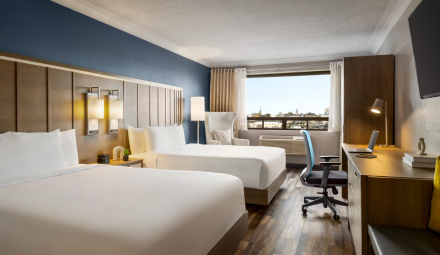 Two beds in a modern style hotel room.